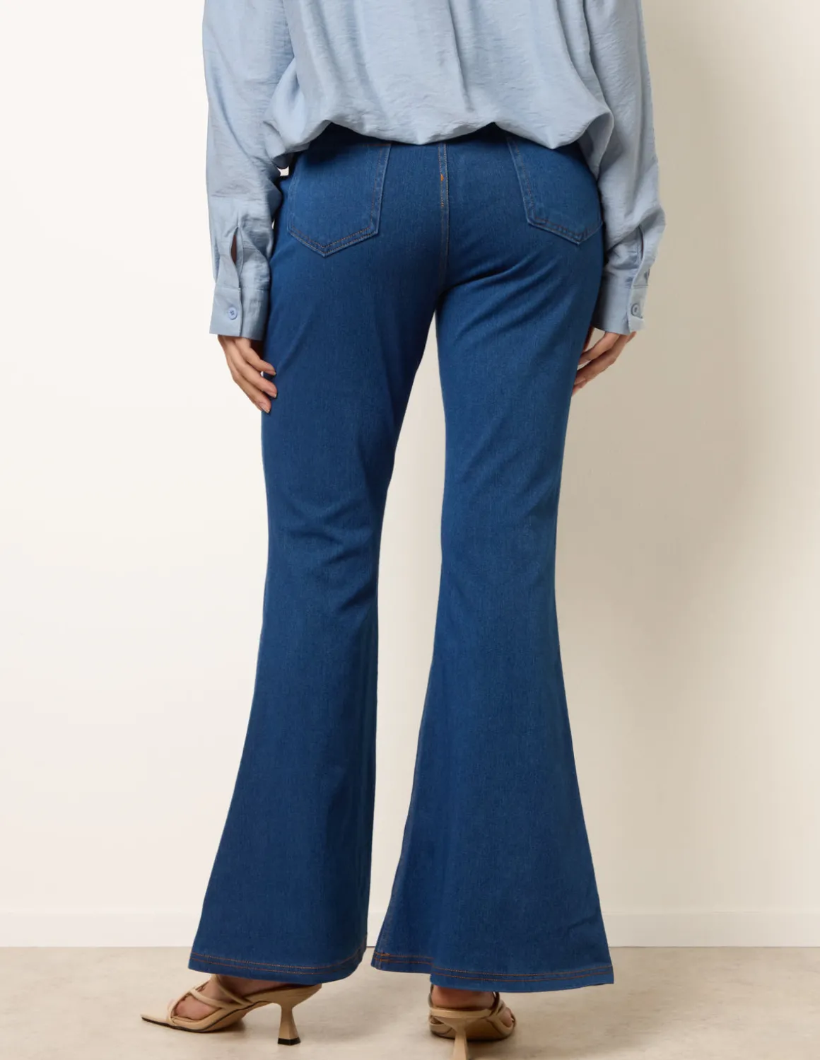 Flared Cross Over Waistband Jeans